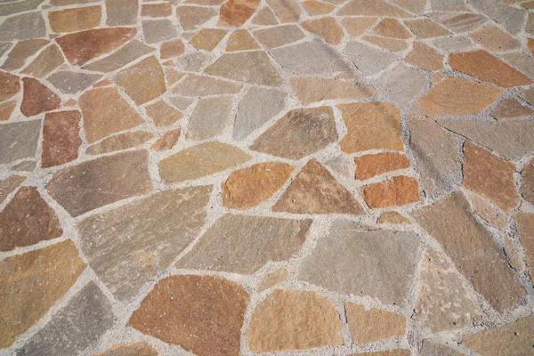 Superfície de estrada de pedra velha laranja no futuro. Textura sem costura. A textura de uma estrada de pedra — Fotografia de Stock