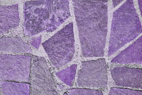 Viola vecchio marciapiede di pietra. Texture senza cuciture. Texture di una strada di pietra — Foto Stock