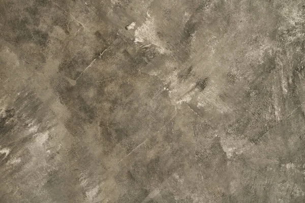 Nahtlose graue Betonstruktur. Der Hintergrund einer Steinmauer mit ungleichmäßigen Strichen. Stockbild