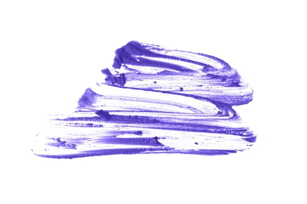 Manchas de batom borradas destacam-se contra um fundo branco isolado.Close-up da textura cremosa da maquilhagem A cor lilás do produto cosmético. — Fotografia de Stock