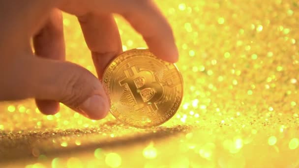 Bitcoin Shiny Gold Background Female Fingers Hold Bitcoin Coin Close — Stock Video