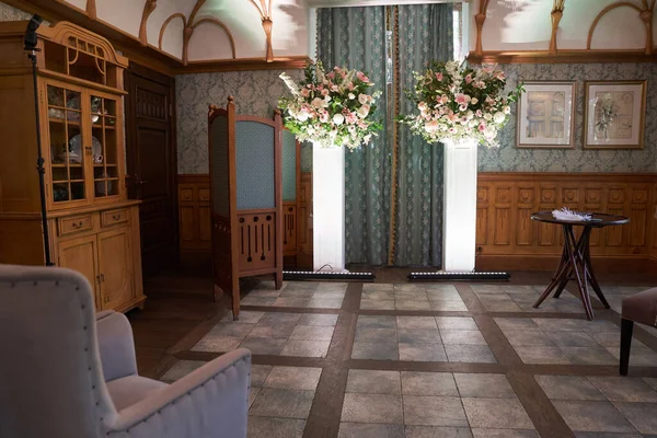 Beautiful vintage hall for a wedding ceremony.Elegant interior design with vintage-style flowers