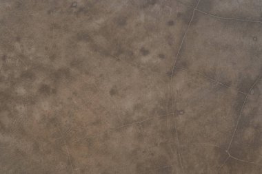 Kusursuz kahverengi beton doku. Taş duvar arka planı. Çiziklerle eski beton zeminin yüzeyi, dizaynınızda kaplama olarak kullanabilirsiniz..