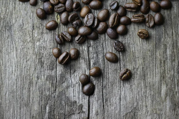 Picture Coffee Beans Stacked Wooden Floor Dark Background Copy Space — Zdjęcie stockowe