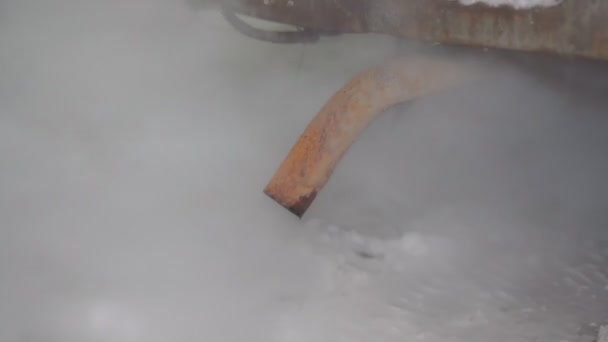 Car exhaust pipe, which comes out strongly exhaust gases. It is winter and the car is dirty. — Stock Video