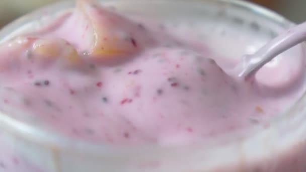 Yogurt with china seeds in a glass, close up, selective focus. — 图库视频影像