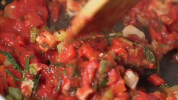 Cooking various vegetables with chicken pepper celery, onion, tomato paste. Selective focus — Stockvideo