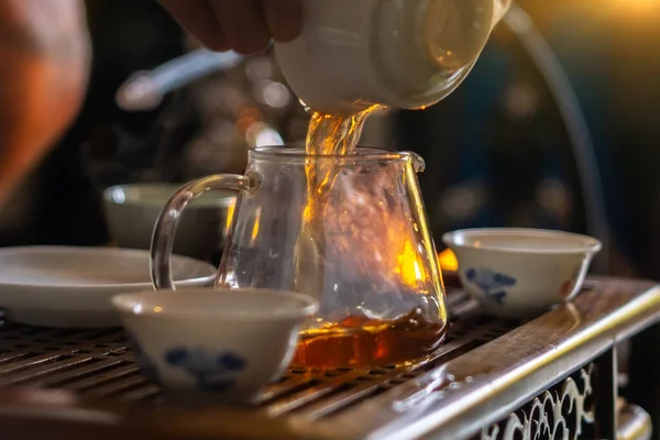 Tea ceremony, pours tea close-up, selective focus, brewing Chinese tea the original method.