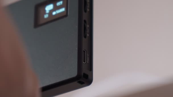 Hand holding USB type C cables to connect or disconnect. Selective focus — Stock video