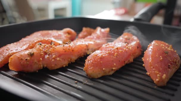 Cooking turkey steaks with spices on a grill pan. Healthy food. Meal for weight loss and fitness. Selective focus — 비디오