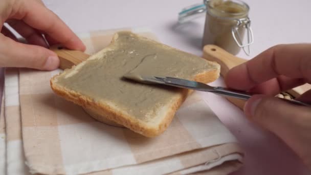 Homemade sunflower seeds butter or spread with roasted seeds. Selective focus — Stockvideo