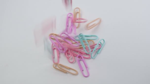 Multicolored Paper Clips Close White Background Stationery Concept Selective Focus — Αρχείο Βίντεο
