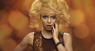 Beauty portrait woman with golden makeup and blonde hair clipart