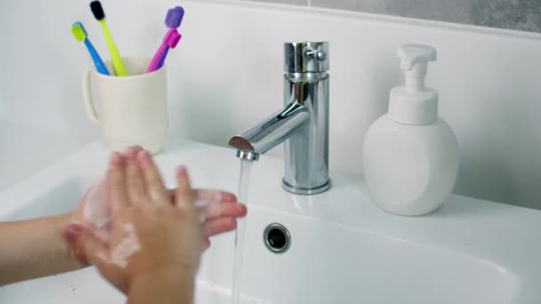 A child washes hands with soap, little girl Hands washing to prevention diffusion of virus and bacteria. Healthcare, Basic home hygiene. — Stock Video