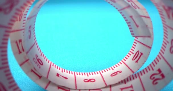 Super macro shot of a measuring tape into a roll of sewing and colored thread on the background blue. Garment factory. Threads,measuring tape,spools of colored threads are visible in frame. — Stock Video