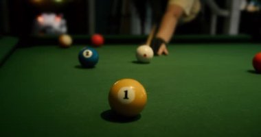 Sports game of billiards on a green cloth. Billiard balls with numbers on a pool table. Billiards team sport
