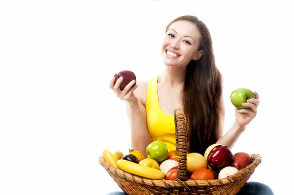 Asian woman with a basket of fruit — Stock Photo, Image