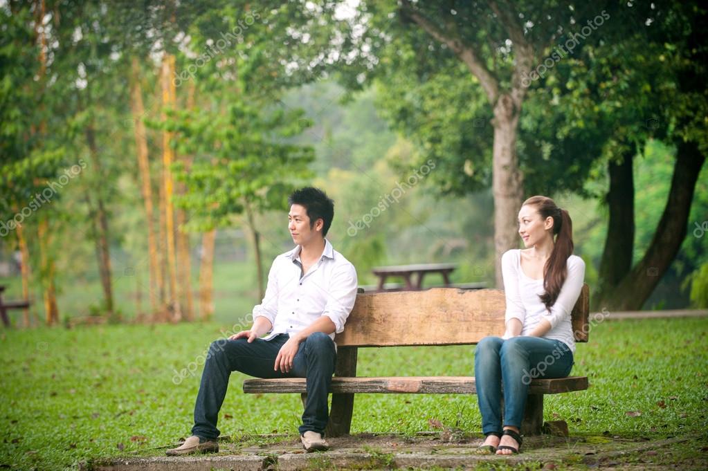 Outdoor watching asian couple