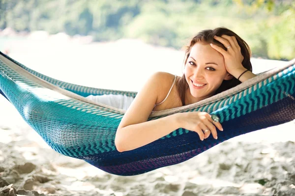 Attractive asian female relaxing on a hammock — Stock Photo, Image