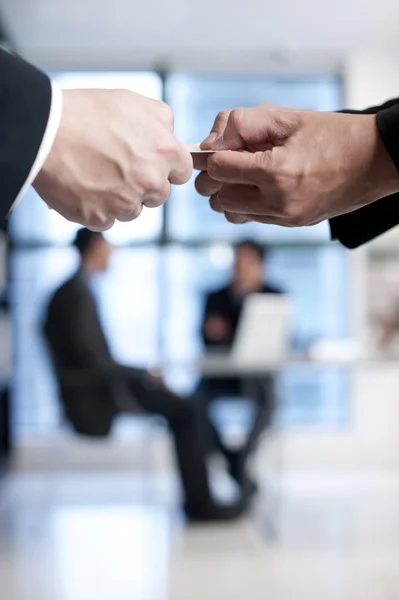 Businessmen giving business card to another — Stock Photo, Image