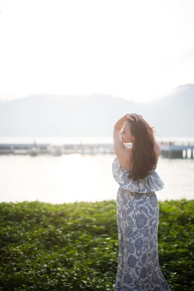 Attractive Asian Female enjoying the morning sea — Stock Photo, Image