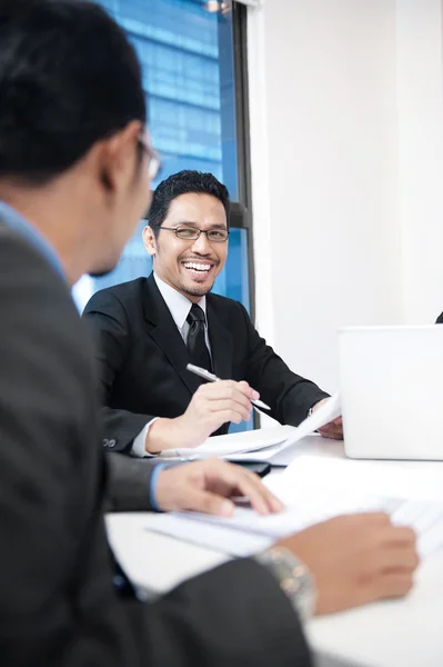 Businessmen laughing on a workplace — Stock Photo, Image