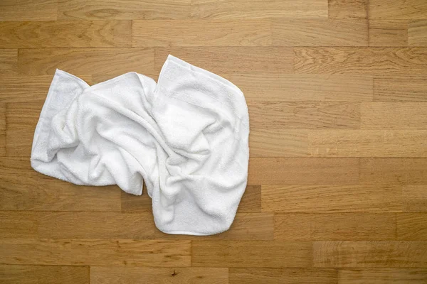 Used White Towel Lying Wooden Floor Hotel Room — Fotografia de Stock