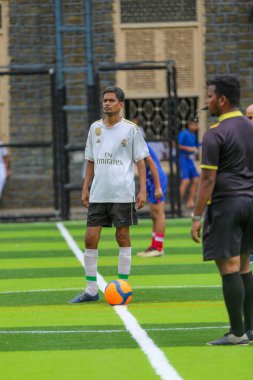 Center foward ready for kick off whistle by reree.