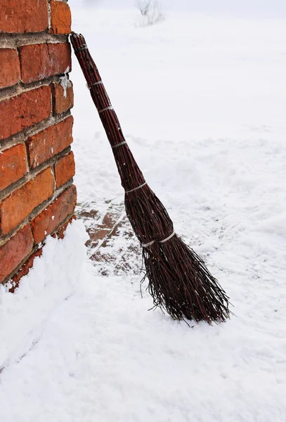 Homemade broom as cleaning equipment on snow winter — Stock Photo, Image