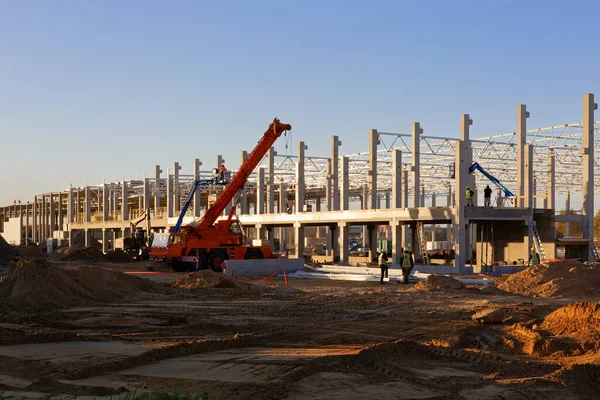 Industrial construction site. Crane build construction plant from steel