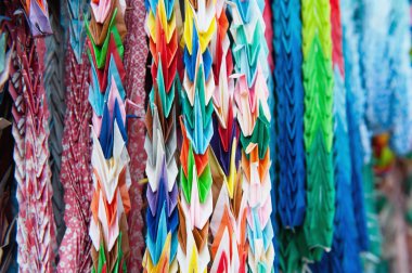 Close up of colorful origami offerings clipart