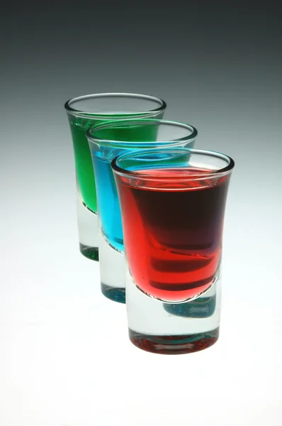 Three shots of alcohol in a row. — Stock Photo, Image