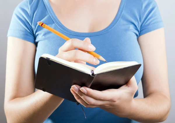 Woman Writing In Notebook — Stock Photo, Image