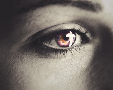 A woman's eye with a cross reflection