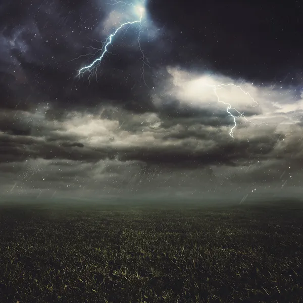 Lightning flash over a field — Stock Photo, Image