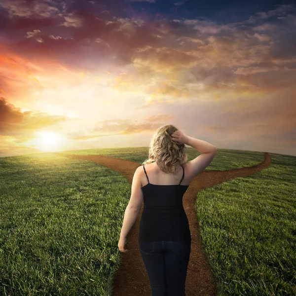 Woman standing on crossroad — Stock Photo, Image