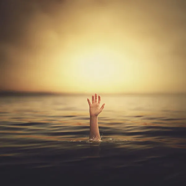 A hand coming out of the water — Stock Photo, Image