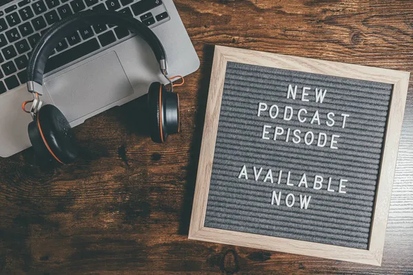 Top view of letter board with text NEW PODCAST EPISODE — Stock Photo, Image