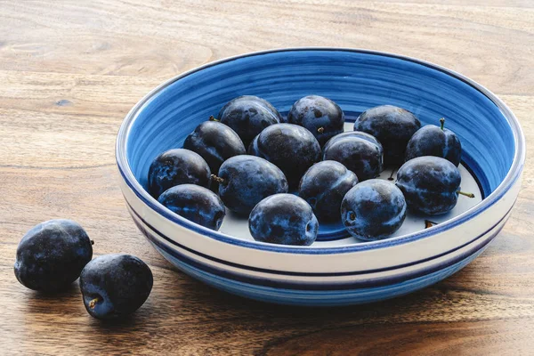 Blue Pottery Bowl Filled Fresh Ripe Prune Plums Rustic Wooden — Zdjęcie stockowe