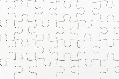 close-up view of plain white jigsaw puzzle background