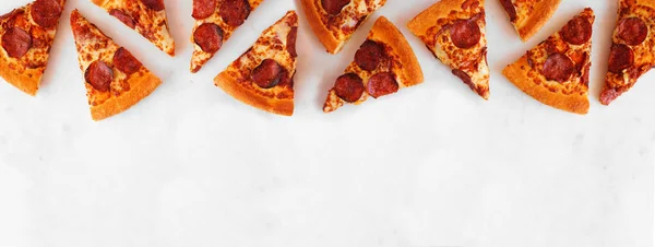 Pepperoni Pizza Slice Top Border Overhead View White Marble Banner — Zdjęcie stockowe