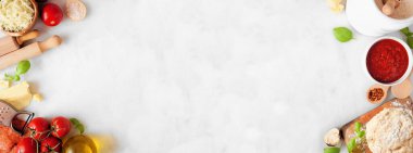 Pizza making ingredients including cheese, pepperoni, tomatoes and basil. Top view double border against a white marble banner background. Copy space.