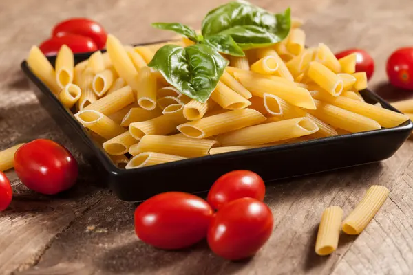 Raw pasta with ingredients. — Stock Photo, Image