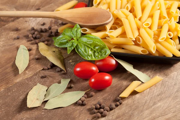 Raw pasta with ingredients. — Stock Photo, Image