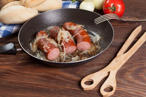 Fried sausage with onions. — Stock Photo, Image