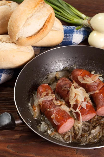 Fried sausage with onions. — Stock Photo, Image