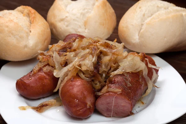 Fried sausage with onions. — Stock Photo, Image