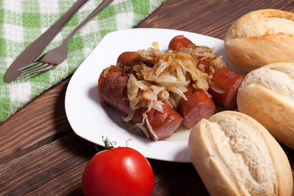 Fried sausage with onions. — Stock Photo, Image