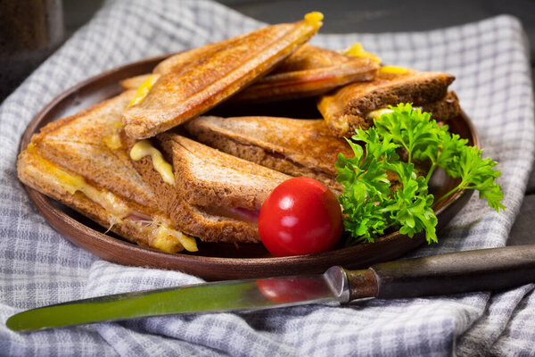 Grilled cheese sandwich on plate. Shallow depth of field.