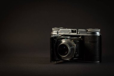 KATOWICE, POLAND - AUGUST 23, 2022: Voigtlander Vito II - vintage film camera on dark background.